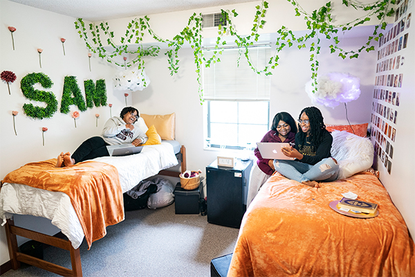 Students in a dorm setting hanging out